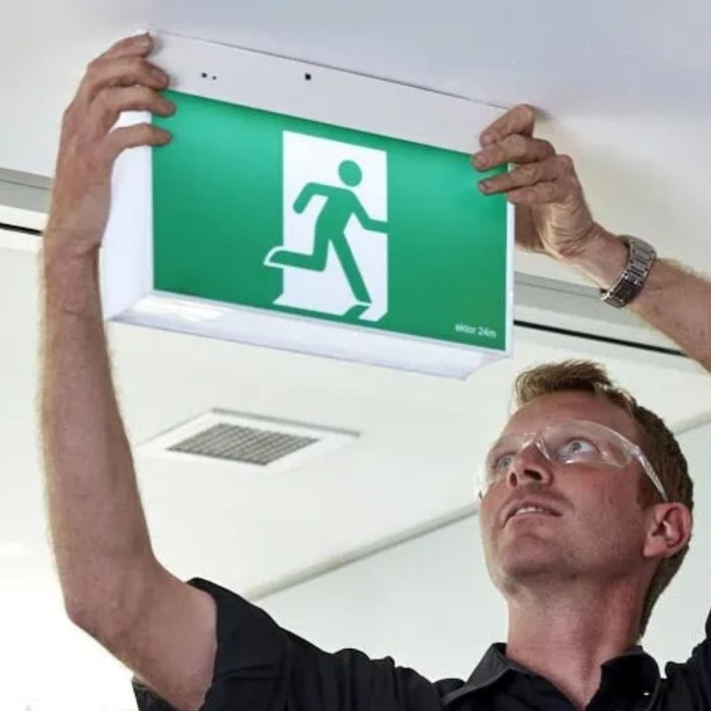 Replacement Service: Replacing batteries in exit signs (tenant area).