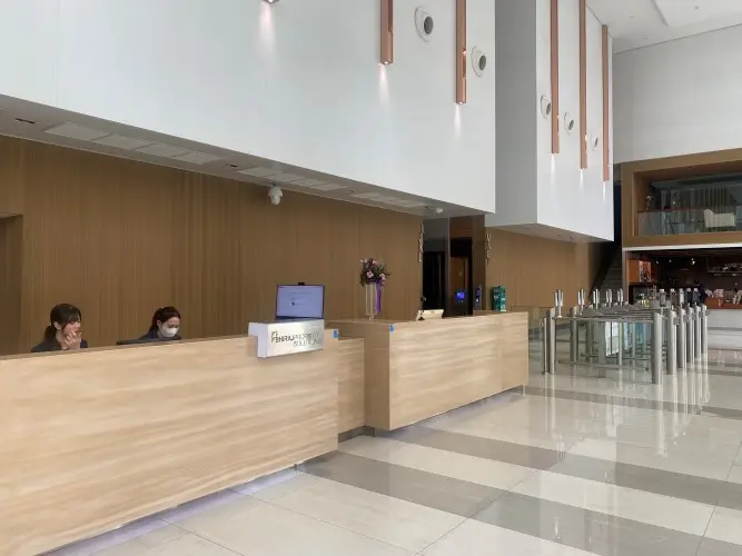 Receptionist in the lobby, G Floor, exhibited unprofessional behavior.