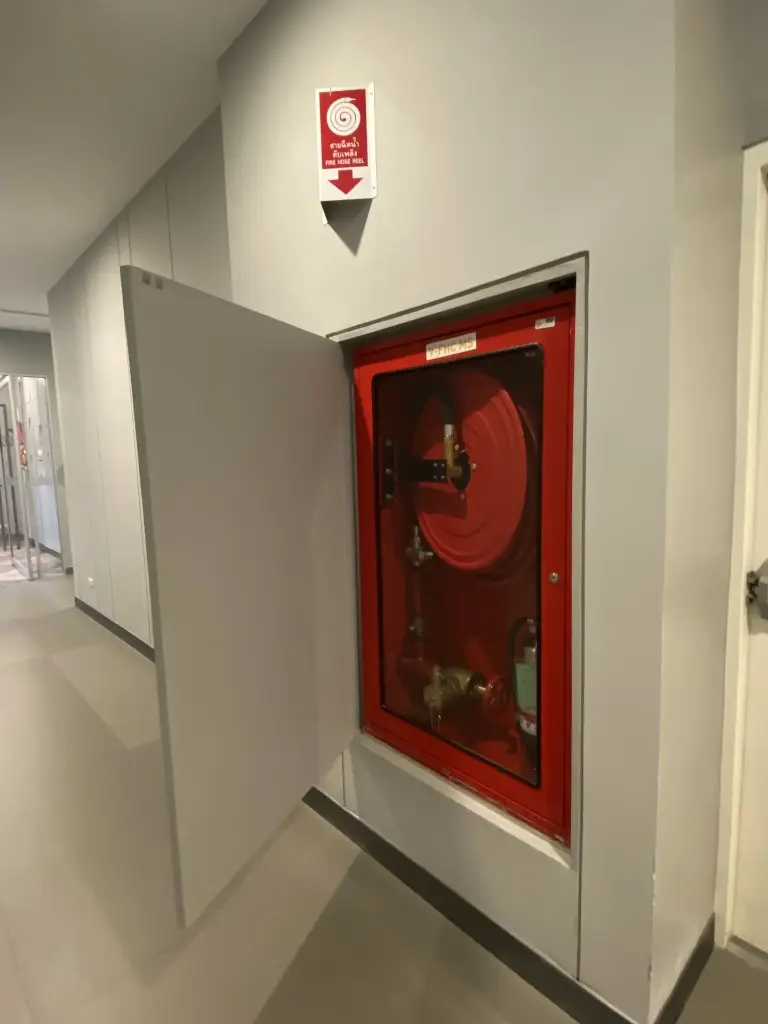 The fire extinguisher cabinet and fire hose cabinet are damaged.